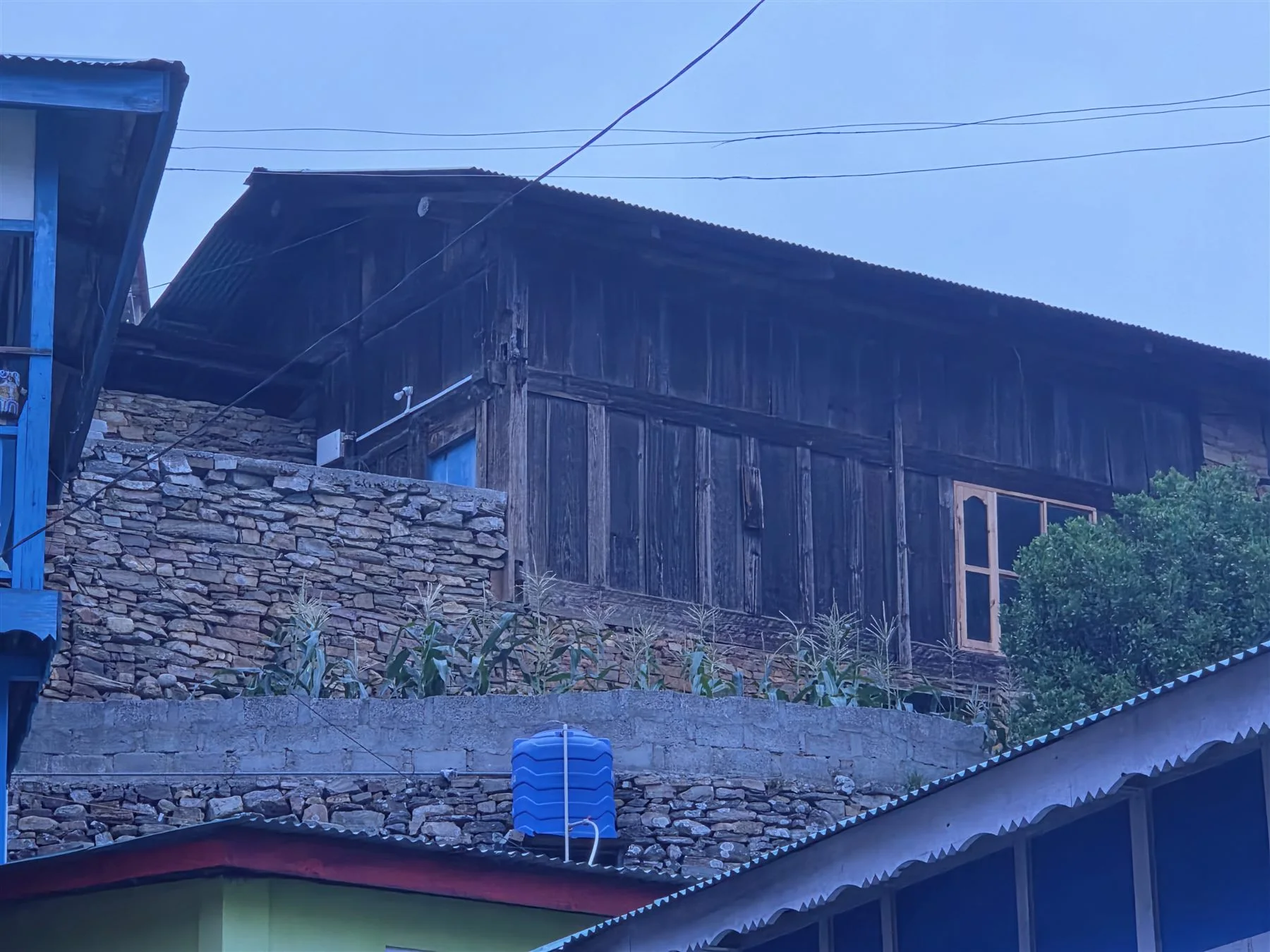 Timber and stone upper storey of the heritage home in Dirang Village